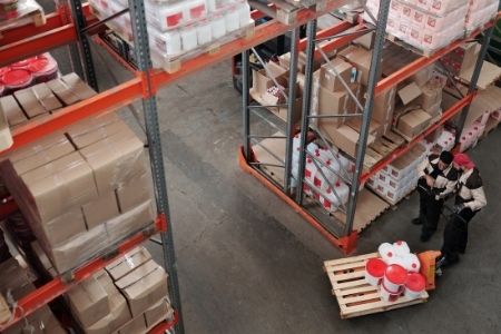 image of men in a wholesale warehouse of Amazon products